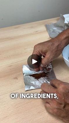 a man is cutting into some food on top of a wooden table with the words ingredients in front of him