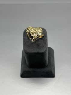 Check out this 10K Gold Ladies Heart Nugget ring! It's pure bling for the ladies, flaunting that golden shine. The heart is 18mm x 19mm giving this ring enough size to slay the game with some serious style, no doubt! Nugget Rings, Gold Heart Ring, Gold Nugget, Gold Heart, Heart Of Gold, 10k Gold, The Game, Heart Ring, Heart Shapes