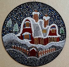 a painting on the side of a wall that is decorated with snow and houses in it