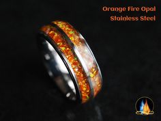 an orange fire opal stainless steel ring with fire inlays on the inside