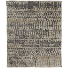 an area rug with grey and beige colors