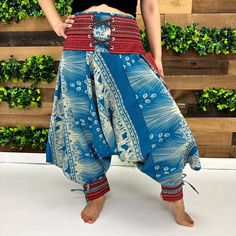 "Cotton Harem Pants with Ankle Straps, Thai Yoga Pants, Elephant Pants, Embroidered Pants,Unisex Pants, Hippie ,Boho Clothing,Low Crotch Pant Handmade Material: Organic Cotton Adjustable Waist Unisexual  One small pocket Size: One Size; Fits from US Size Small to Large Waist: Approx.28\" to 38\" Hips: Approx.  24\" to 48\" Length: Approx. 35\" Our Unisex Cotton Harem Pants provide a comfort-first design ideal for any season. Crafted from a lightweight, breathable cotton blend, these harem-style pants are perfect for yoga or casual wear. With a unisex style, adjustable ankle straps, and a relaxed fit, these pants offer the perfect combination of fashion, comfort, and versatile wearability. These Cotton Harem pants with open-side legs and ankle cuffs with adjustable straps are very comfortab Blue Baggy Embroidered Bottoms, Bohemian Non-stretch Bottoms With Boho Print, Blue Bohemian Bottoms With Boho Print, Bohemian Blue Bottoms With Boho Print, Spring Festival Ankle-length Harem Pants, Bohemian Blue Embroidered Pants, Blue Bohemian Embroidered Pants, Spring Boho Print Harem Bottoms, Blue Boho Print Hippie Bottoms