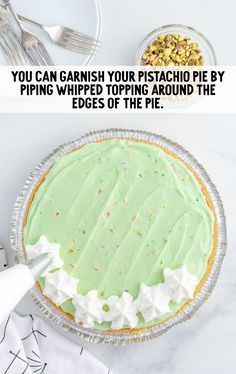 a pie sitting on top of a white table next to a fork and knife with the words you can garnish your pistachio pie by piping whipped toppings around the edges of the pie