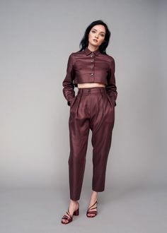 Introduce both a new color and texture to your wardrobe with the IRA LYSA Merlot Linen Pants. Reach for these Chocolate or Burgundy color linen pants when completing your next sleek look. Tired of wearing black all the time? Spice it up with an earth tone and a high-waisted easy silhouette. Go from the office to an evening stroll with ease in these pants. The styling options are endless and the color flattering. * Pegged pants* High rise with belt and loops* Pockets* Deep pleats on the front* Cr Pegged Pants, Pleat Pants, Peg Pants, Easy Silhouette, The Ira, Fashionable Dresses, Reversible Top, Lace Trim Blouse, Black Spaghetti Strap