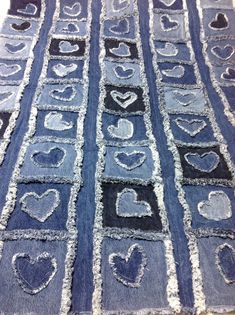 an old piece of denim with hearts drawn on it