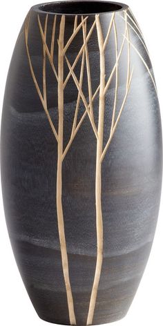 a black vase with trees painted on it