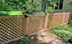 a wooden fence in front of a house