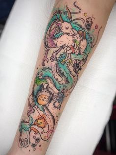 a woman's leg with an artistic tattoo design on the side of her arm