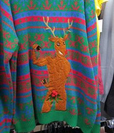 an ugly sweater with a deer on it