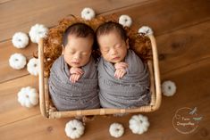 two newborn babies are wrapped in blankets and sleeping