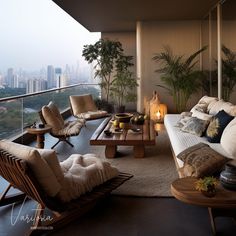 a living room filled with furniture next to a tall window covered in plants and foliage