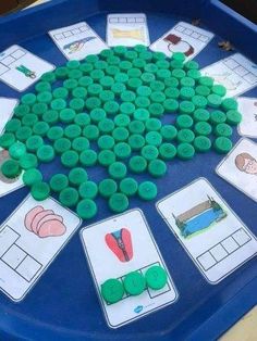 a blue tray with some green buttons on it