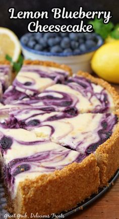 a lemon blueberry cheesecake on a wooden table