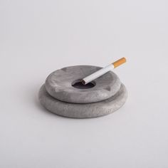 Two-piece ashtray, base and lid hand-carved in marble stone.  It belongs to the Pebbles collection, distinguished and inspired by rounded, risky and modern shapes.  Unique and beautiful. Avoid abrasives and domestic cleaning materials. Use a soft, dry cloth to wipe the surface carefully. Ashtray Clay, Stone Ashtray, Ashtray Design, Ashtray Pottery, Marble Ashtray, Interior Design Accessories, Pottery Ashtray, Marble Accessories, Domestic Cleaning