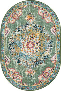 a round rug with an ornate design in green, blue and orange colors on the floor