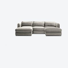 a large sectional couch sitting on top of a white floor