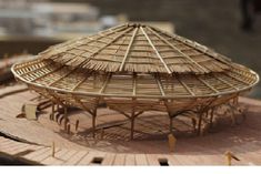 a model of a building made out of bamboo sticks