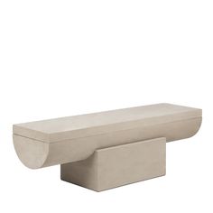 a large concrete bench sitting on top of a white floor