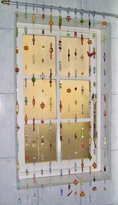 a window with glass beads hanging from it's sides