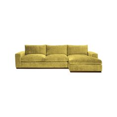 a large yellow couch sitting on top of a white floor