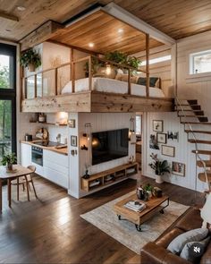 a living room filled with furniture and a loft bed next to a tv on top of a wooden table