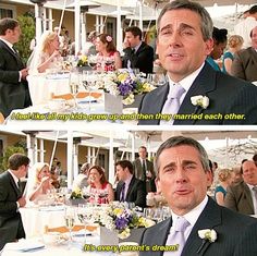 a man in a suit and tie sitting at a table