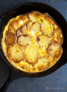 an omelet in a cast iron skillet on a table