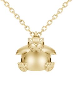 a gold necklace with an animal charm on it