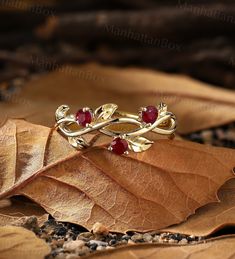 Design by ManhattanBox ITEM DESCRIPTION ✦Available in yellow, white or rose solid 14 or 18k gold. ✦Band width approx 2.3mm ✦Band thickness approx 1.2mm Stone: Natural Ruby Shape: Round Size: 3mm Total Weight: about 2.5g Diamond band: https://www.etsy.com/listing/950683183 Akoya Pearl band: https://www.etsy.com/listing/1048255431 Visit my shop for more jewelry: https://www.etsy.com/shop/ManhattanBox PRODUCTION Every Jewelry is made from the very scratch, and made by hand and carefully polished es Red And Gold Ring, Ruby Wedding Band, Wedding Band Unique, Natural Ruby Ring, Ruby Ring Gold, Twig Ring, Ruby Wedding, Full Eternity Ring, Golden Ring