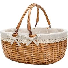 a wicker basket with white lace and bows