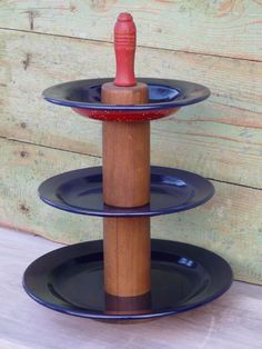 three tiered plate stand with red and blue plates