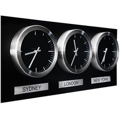 three clocks with different time zones displayed on a black wall mounted clock panel that says sydney, new york, and london