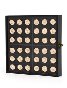 a black and gold coin display case with six different types of coins in each section