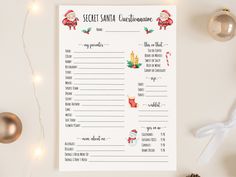 a printable secret santa christmas game is shown on a table with ornaments and lights