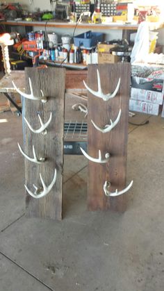 two pieces of wood with white deer antlers on them