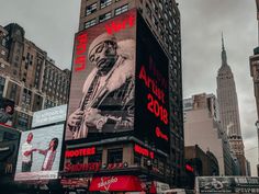 a large billboard on the side of a building in new york city