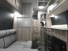 the interior of an rv with wood paneling