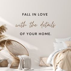 a bedroom with a bed, chair and wall decal that says fall in love with the details of your home