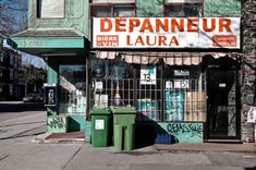 a storefront with graffiti on the side of it