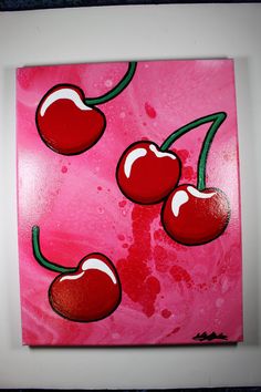 a painting of three cherries on a pink background