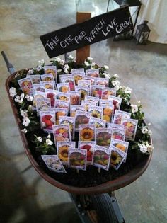 a wheelbarrow filled with lots of cards and flowers