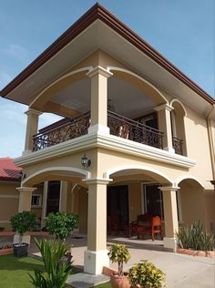 a large house with an attached balcony and balconies