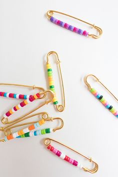 multicolored paper clips on white background