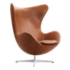 the egg chair is brown leather with chrome legs