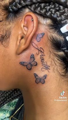 a woman's ear with butterflies on it and the word believe written in cursive writing