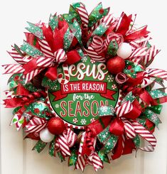 a christmas wreath that says jesus is the reason for the season