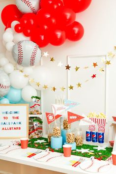 a baseball themed birthday party with balloons and snacks