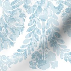 a blue and white wallpaper with floral designs on the back ground, in shades of light blue