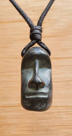 Easter Island Head Moai pendant. I handcarved this pendant by hand from green granit, it's south Indian stone semiller to soapstone but more hard and durable then the soapstone. The colour of the stone is very dark green almost looks black.  The size of the pendant is approx 3cm x 1.5cm (1.2 x 0.6 inches ). The pendant comes with an adjustable black waxed cotton cord. Not only are these pendants a beautiful thing to wear as part of your jewellery collection, but they are also very pleasing to the touch. The weight and smoothness of the hand carved stone makes these pendants a tactile comfort, as well as a one of a kind adornment. Moai (Ester Island Head) Moʻai, or moai, are monolithic human figures carved by the Rapa Nui people on Easter Island in eastern Polynesia between the years 1250 a Sand Stone Carving, Stone Wall Art Pendant, Wood Stone Necklace, Carving Resin With Dremel, Dremel Necklace, Easter Island Heads, Indian Stone, Protection Talisman, Pebble Pendant