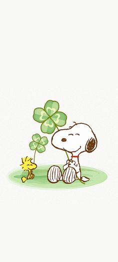 a drawing of a person sitting next to a small dog and a four leaf clover